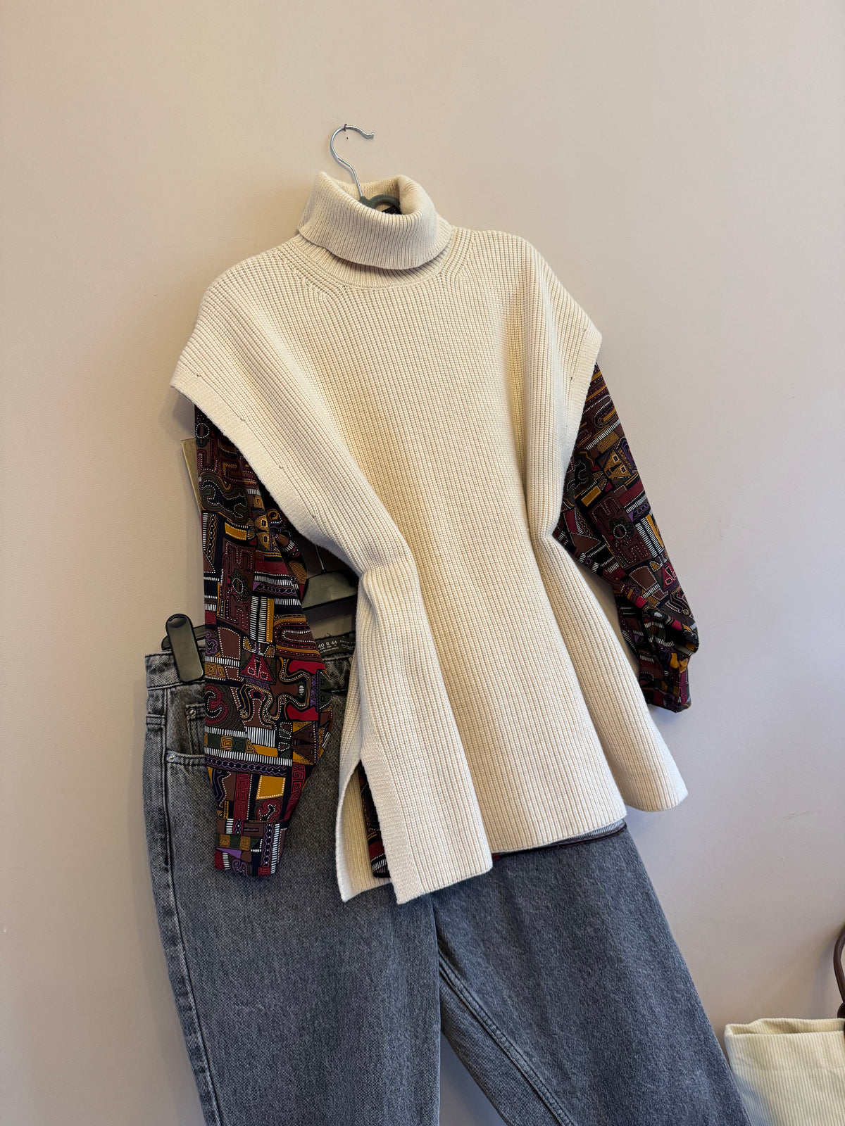 Cream roll neck sleeveless knit