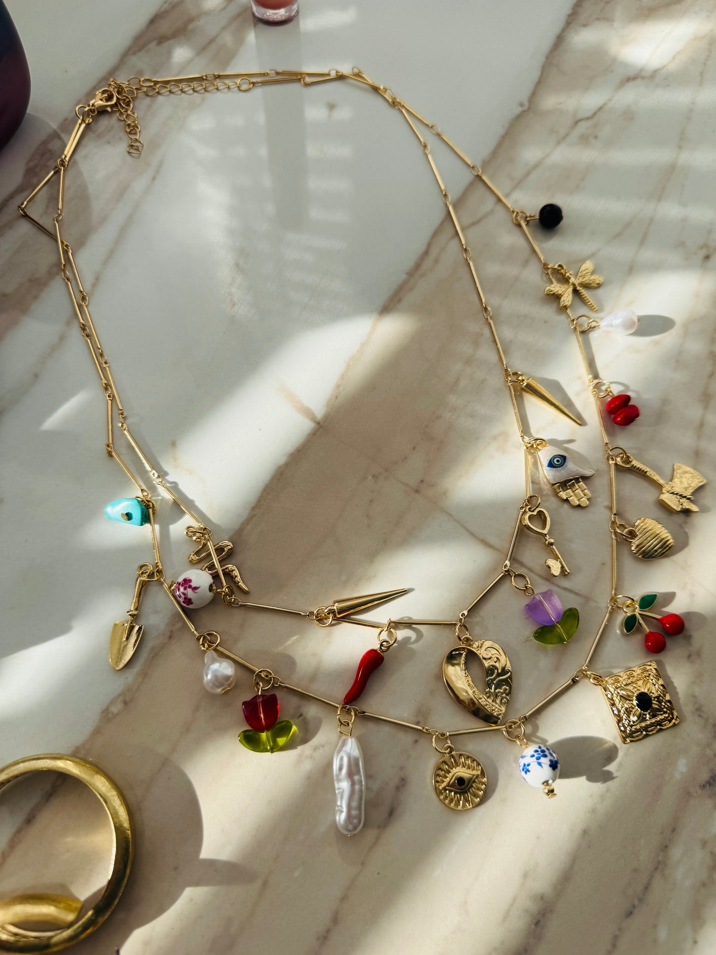 ‘Stacker’ charm necklace set.