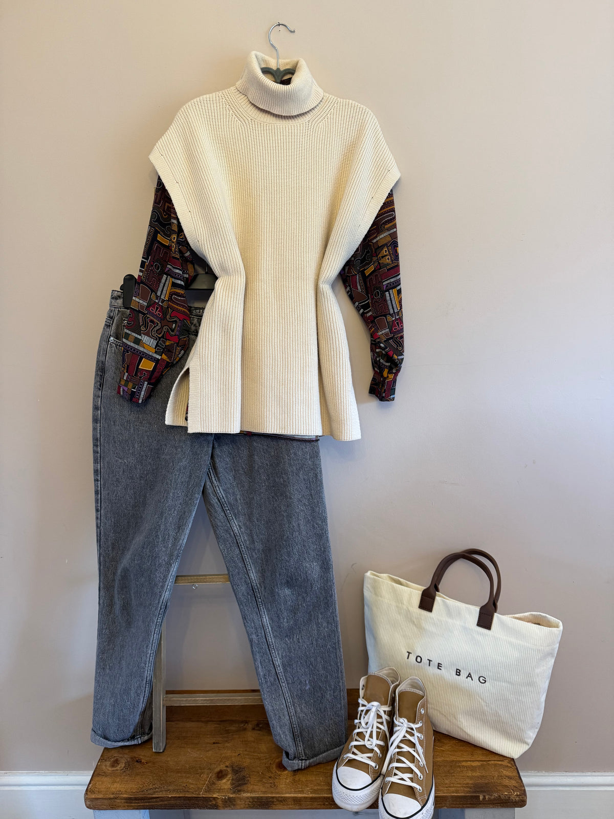 Cream roll neck sleeveless knit