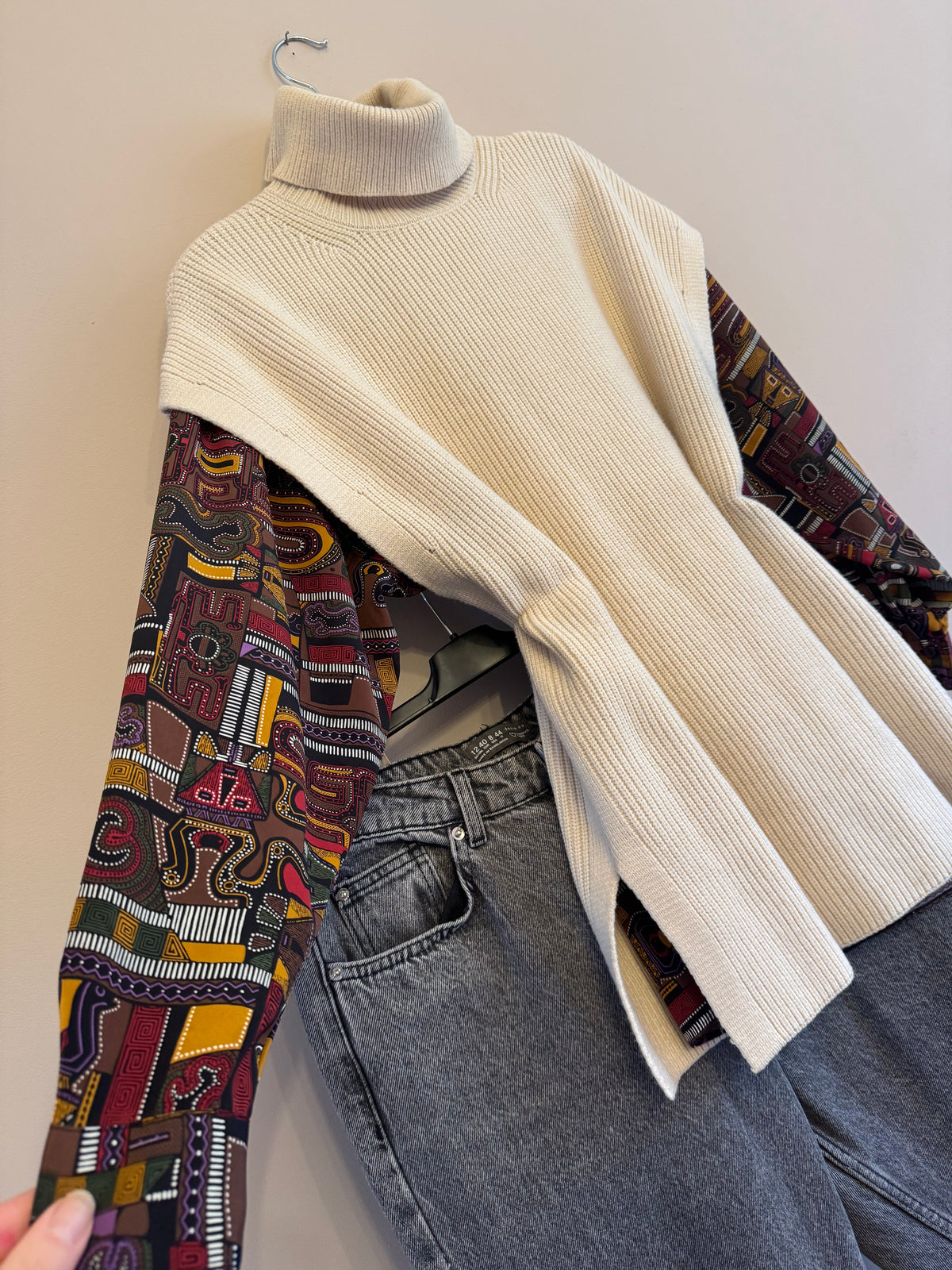 Cream roll neck sleeveless knit